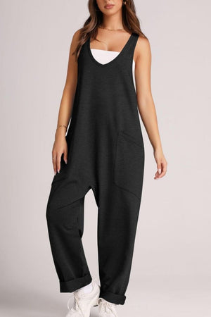 Black relaxed fit jumpsuit with V-neck, sleeveless, oversized pockets, and cuffed ankles.