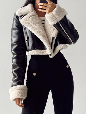 Black aviator jacket with white shearling trim and collar, cropped length