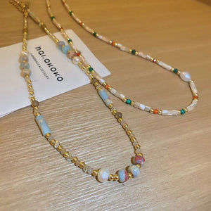 Multi-strand gemstone collar necklace with gold beads and pearls, multicolor and light blue stones
