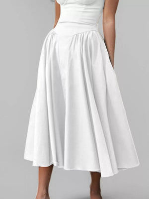 White sweetheart midi dress with spaghetti straps and a full skirt.