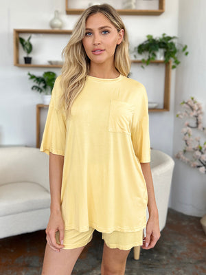 Yellow bamboo loungewear set with relaxed fit tee and shorts, featuring a chest pocket.