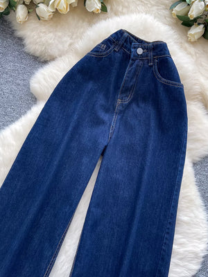 Dark wash maternity jeans with high-rise and wide leg cut in denim.