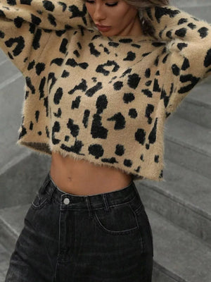 Cropped fuzzy leopard print knit sweater with a crew neck and long sleeves.