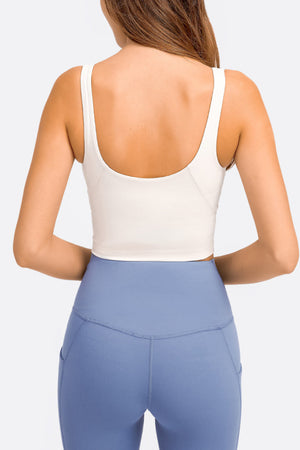 White scoop neck crop top with wide straps, shown from the back.