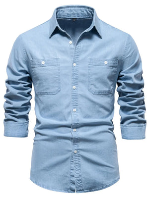 Light blue faded denim utility shirt with two chest pockets and button-down closure.