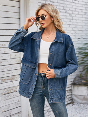 Chic denim button-up jacket in dusty blue with two chest pockets and a relaxed fit.
