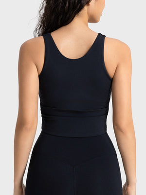 Black athletic tank top with ruched detail at the waist and a scoop neckline.