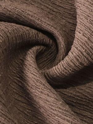 Brown crinkled wide-leg pants fabric detail