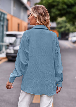 Sky blue textured overshirt with relaxed fit and buttoned cuffs.