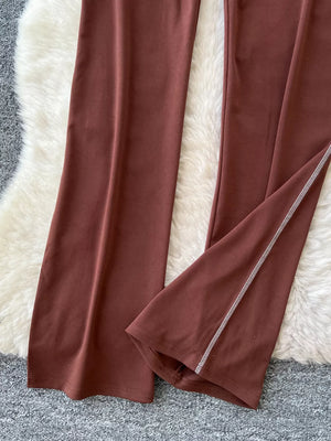 Brown maternity pants with wide legs and contrast stitching detail on the hem.