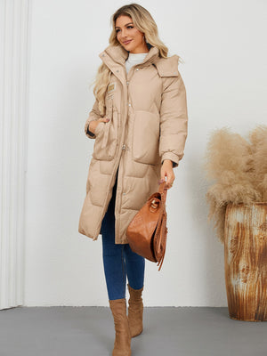 Camel quilted puffer parka with buckle detail and large pockets.
