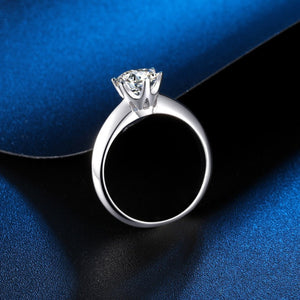 Sterling silver solitaire ring with a brilliant moissanite stone.