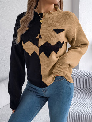 Split-Face Pumpkin Knit Sweater in black and camel acrylic with a jack-o-lantern face detail.