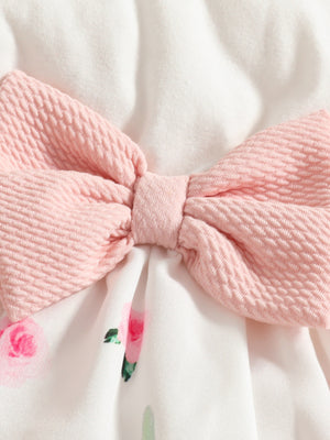 Baby dress with pink bow detail and floral print