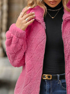 Pink textured teddy zip-up jacket with a quilted pattern and fuzzy material.