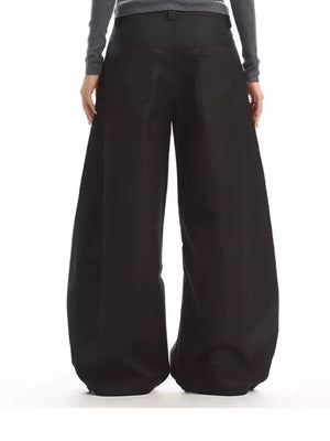 Black relaxed fit button-fly wide-leg chinos with decorative back pockets.