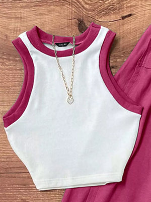 White polyester tank top with contrast trim and matching maxi skirt, styled with a necklace.