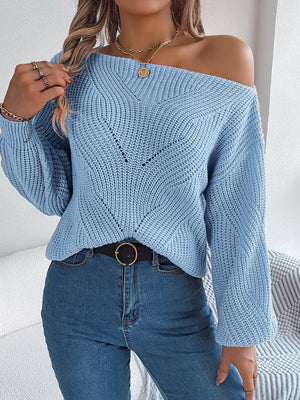 Off-the-shoulder Misty Blue knit sweater with openwork detail and V-neck.
