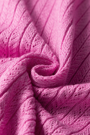 Red-violet knit blouse with square neckline and flutter sleeves, 100% viscose fabric detail.