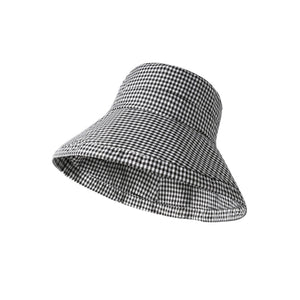 Gingham wide brim bucket hat in black and white checkered pattern.