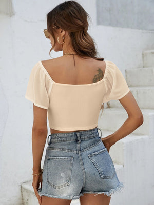 Tan ribbed crop top with chiffon puff sleeves and square neckline.