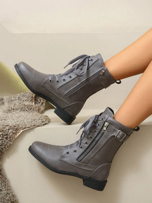 Dark gray combat boots with lace-up front and side zipper detail.