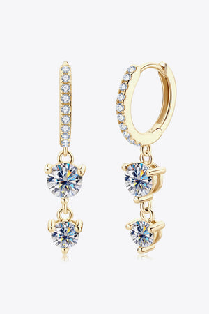 Gold moissanite hoop earrings with cascading diamond accents and dangling stones.