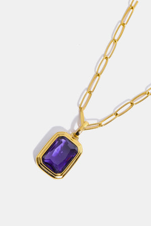 Gilded Prism Pendant Necklace with purple gem and gold paperclip chain.