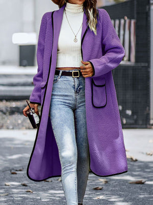 Purple teddy coat with contrast trim, open front, long sleeves, and patch pockets.