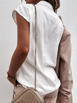 White short sleeve v-neck blouse with subtle seam detail.