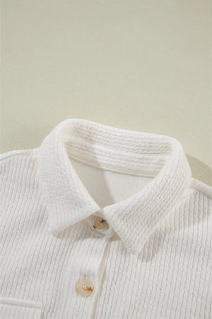 White textured corduroy overshirt with button front and patch pocket detail.