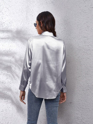 Satin button-up shirt in silver with a relaxed fit and button cuffs.