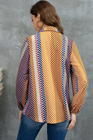 Blouse with geometric print, blouson sleeves, and a collared neckline in orange and blue.