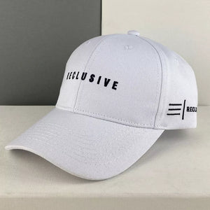 White cotton baseball cap with black embroidered text and logo detail.