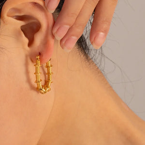 Gold coiled wire hoop earrings with stacked detail