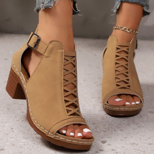 Khaki criss-cross cut-out block heel sandals with ankle strap detail.