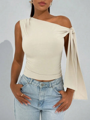 Apricot asymmetrical tie detail blouse with one-shoulder neckline and cropped length.