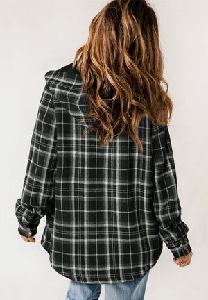 Sherpa-lined plaid overshirt jacket in black with button cuffs and a hood.