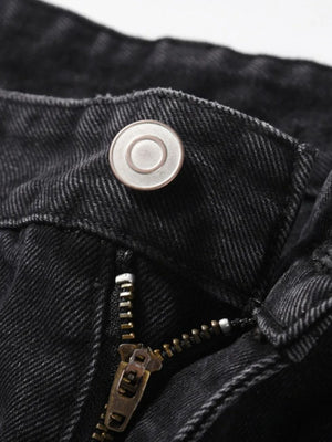 Black denim jeans with button and zipper detail