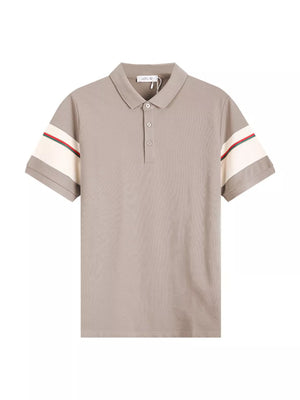 Desert color polo shirt with cream sleeve accents and red and green stripes.