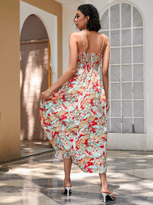 Chic floral midi dress with spaghetti straps and smocked bodice in red and blue paisley print.