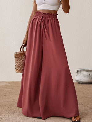 Ruffled waist palazzo trousers in rust with drawstring and wide leg.