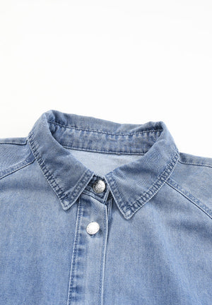 Light blue denim shirtdress with button front and collared neckline.