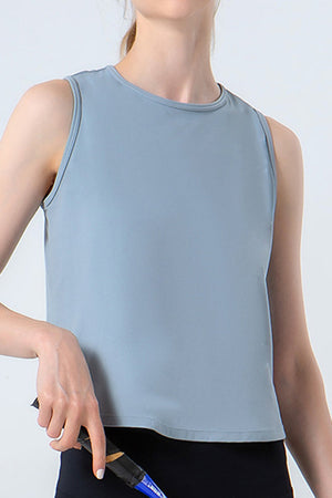 Dusty blue performance tank top with a round neckline and sleeveless cut.