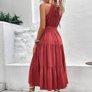 Burgundy halter neck tiered midi dress with belted waist and tie back detail.