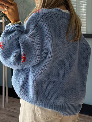 Light blue acrylic knit jumper with red western boot intarsia detail and subtle red stitching.