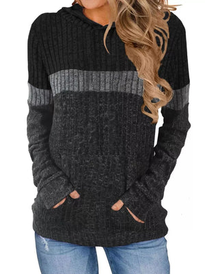 Color block ribbed knit hoodie with pockets in black and gray.