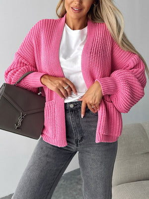 Hot pink textured puff sleeve cardigan with pockets, open front, and ribbed knit detail.