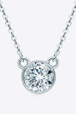 Silver solitaire moissanite bezel necklace with a delicate chain.