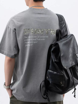 Men's dark gray cotton t-shirt with round neck and letter graphic on back.